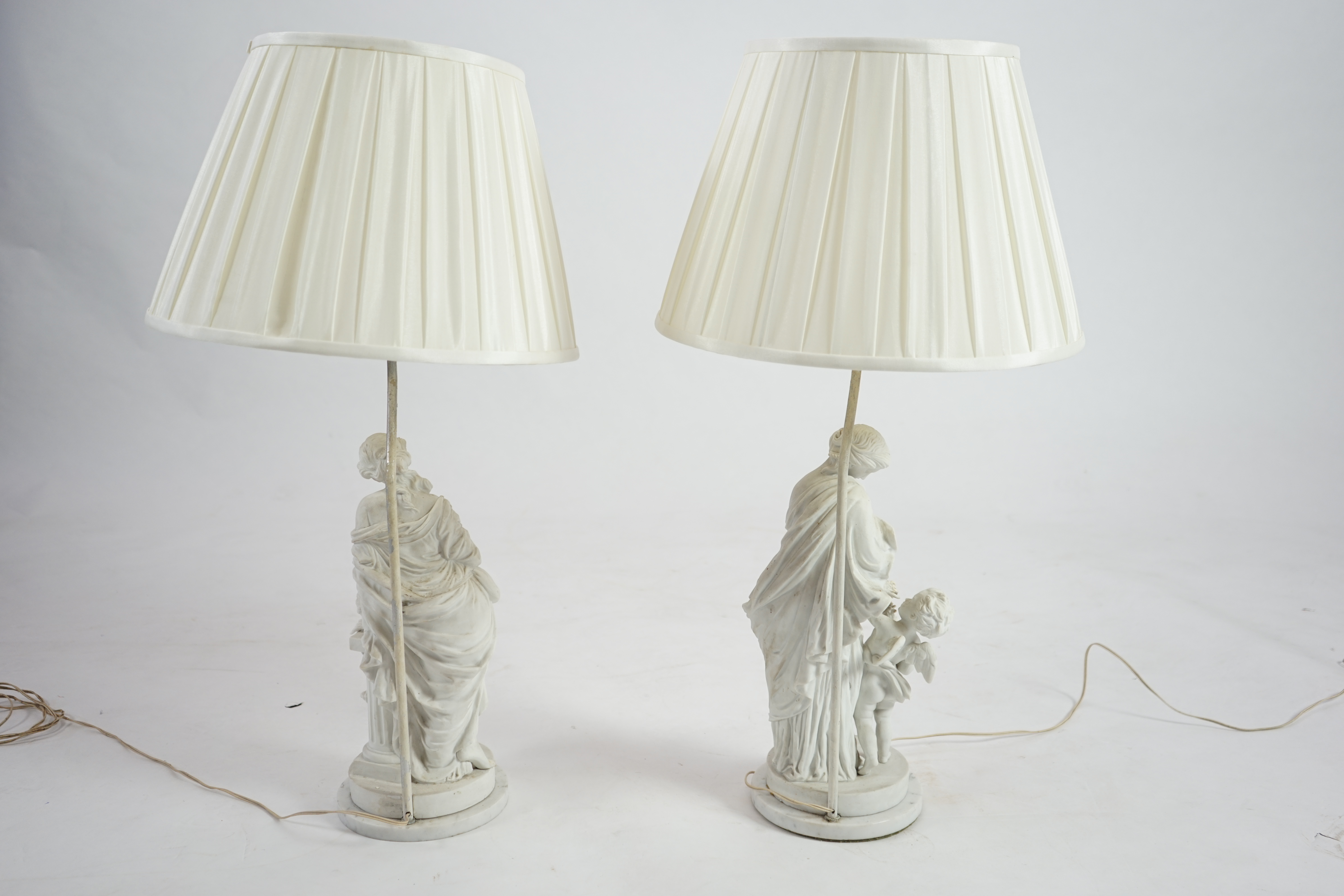 A pair of 19th century French bisque groups, depicting the seasons, Summer and Winter